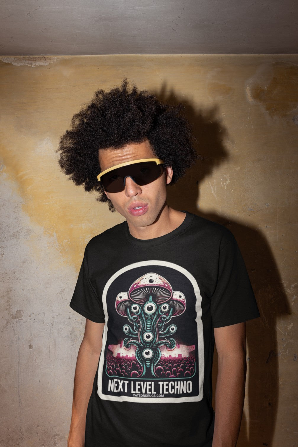 Model wearing Next Level Techno Rave T-Shirt at a music festival