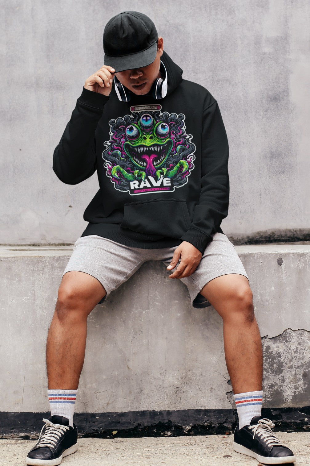 Close-up of DJ Clothing neon print design on black hoodie  