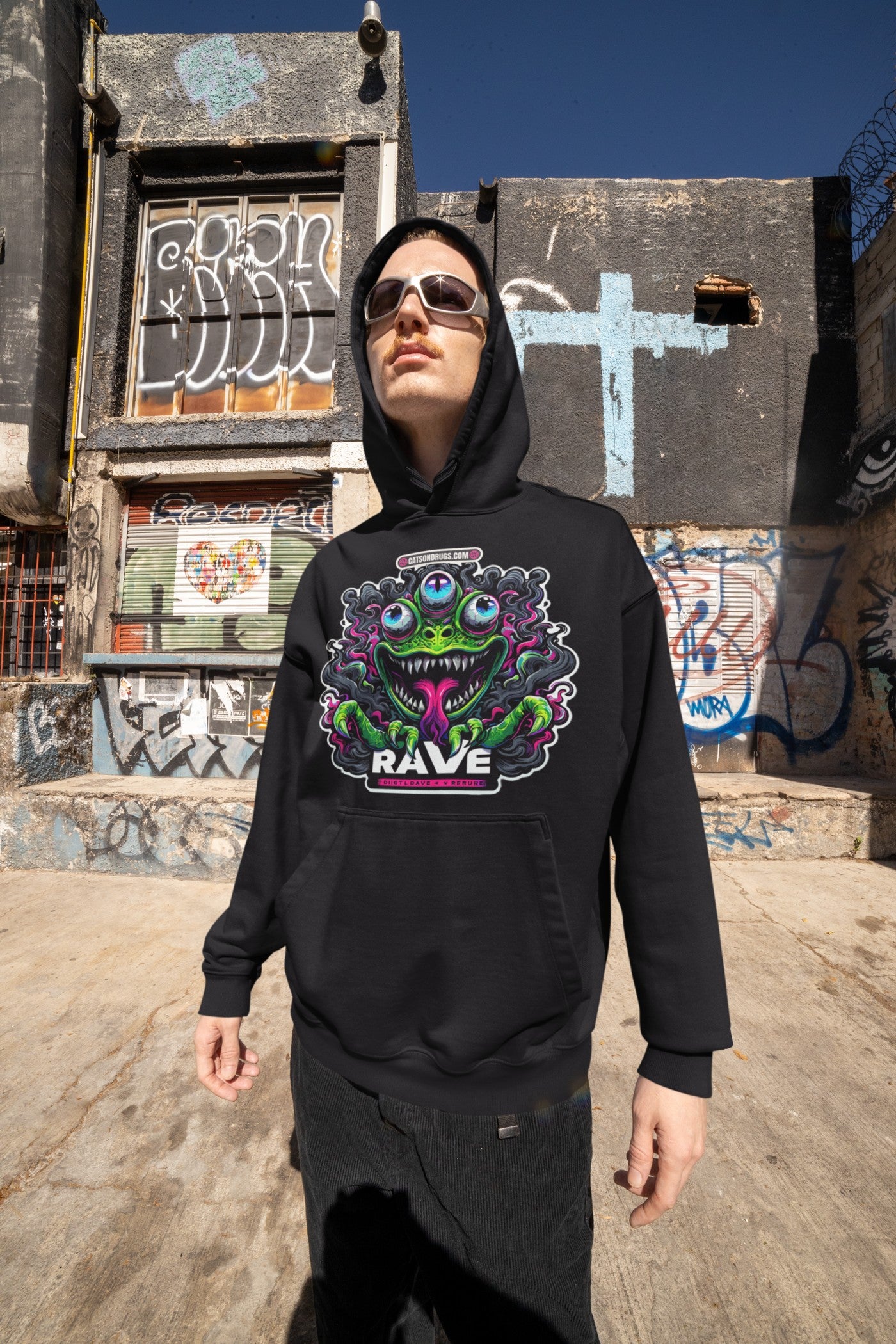 Model wearing DJ Clothing hoodie with club night motif under festival lights 